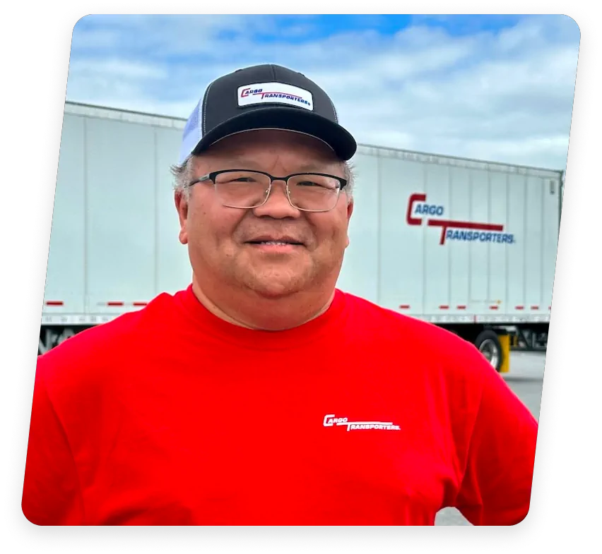 Cargo Transporters driver in front of truck offering CDL A jobs in Catawba County