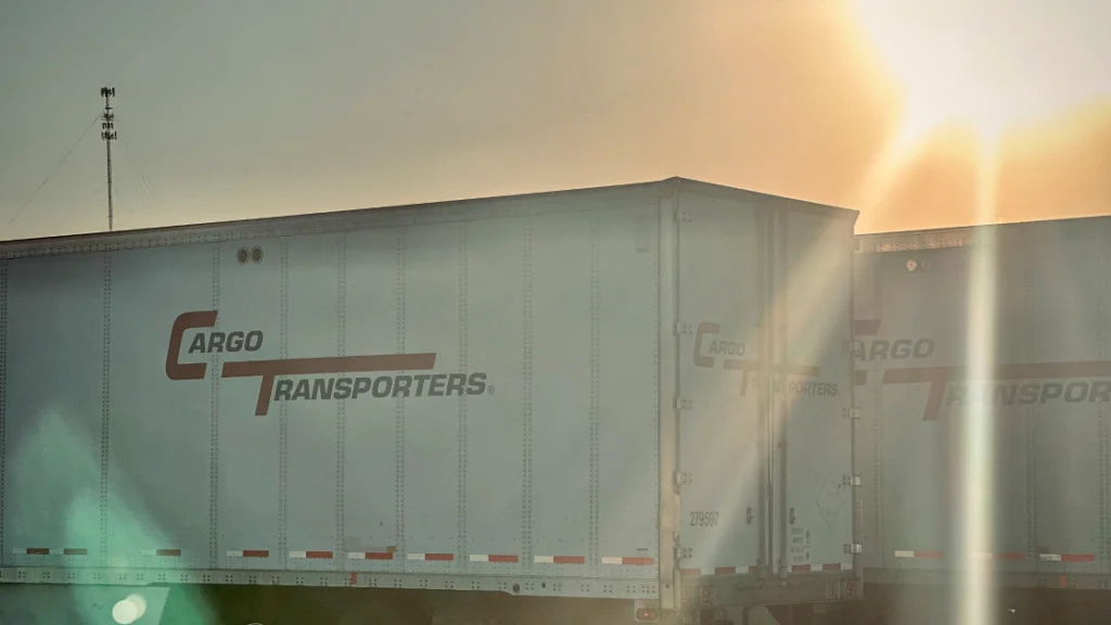 Cargo Transporters trailers at sunset showcasing reliable yard logistics services.