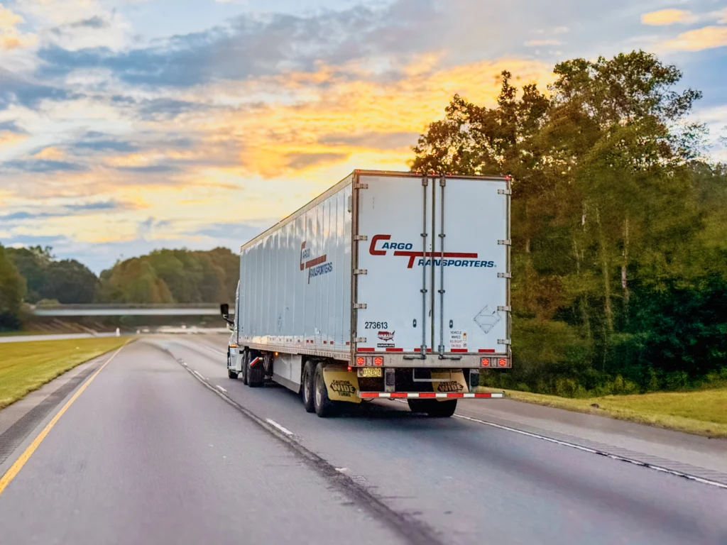Cargo Transporters FTL dry van truck driving on a highway in the Carolinas.