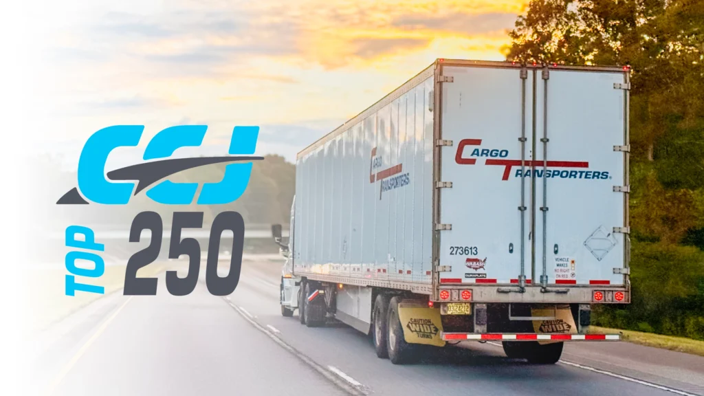 Cargo Transporters semi-truck on the highway featuring the Commercial Carrier Journal (CCJ) Top 250 logo overlay.