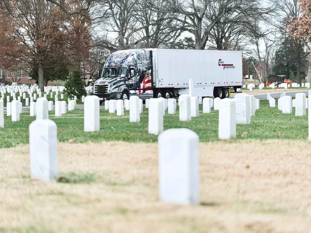 A Cargo Transporters custom "Ride of Pride" truck, driven by Rick Wyatt, at Arlington National Cemetery for Wreaths Across America 2025.